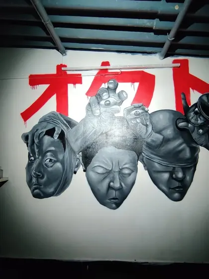 The full "STATES OF MIND" mural, featuring three distinct characters. This was a personal project to practice different shading techniques and facial structures, all painted in a realistic, monochrome style.