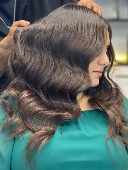 A side view of this stunning brown hair, showing off the healthy waves and beautiful color.