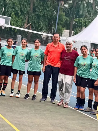 Our girls' team getting some final words of wisdom from Mr. Anjan Ghosh, a Shanghai expert, before their tour. Cultural prep is just as important as on-court practice.