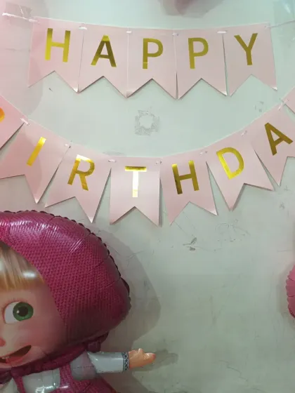 Themed 'Happy Birthday' banner and character balloons for the Masha party.
