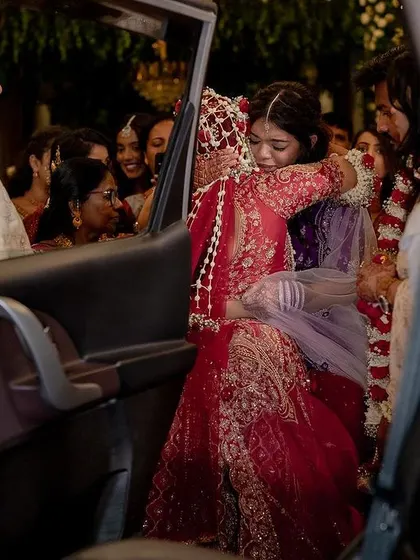 The vidaai, an emotional farewell. We capture the bittersweet tears and tight hugs that mark the bride's departure to her new home.
