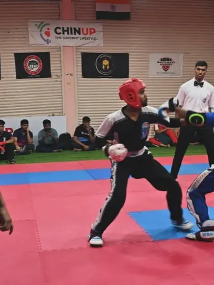 A referee watches closely as two athletes compete. We emphasize fair play and respect for the rules in every match, ensuring a safe and competitive environment.