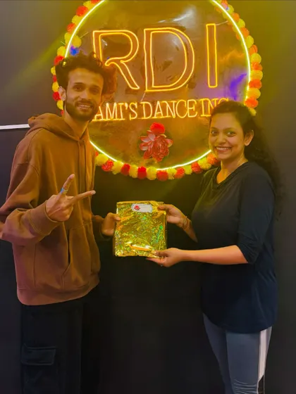 Our lead choreographer Akshay presenting a prize. We believe in celebrating progress and making the learning process rewarding.