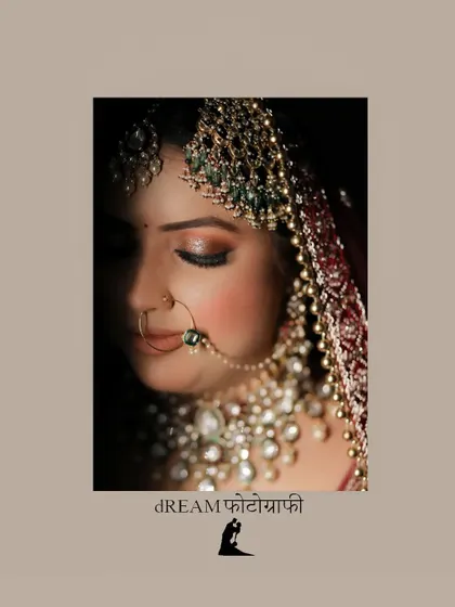 A close-up portrait focusing on the bride's stunning polki and pearl necklace and her serene expression.