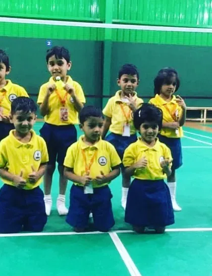 The smiles and fun poses say it all. This is a group of kids who just played hard, had fun, and enjoyed the game together at my badminton academy.