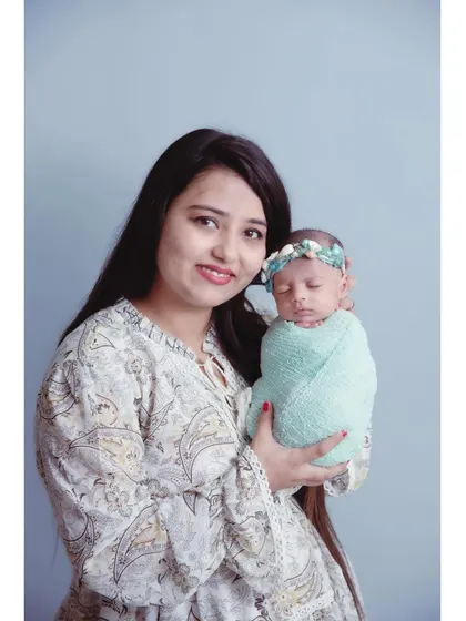 A classic portrait of mother and child. The simple background and soft lighting put all the focus on the beautiful connection between them.