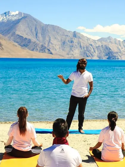 Teaching a yoga class on the shores of Pangong Lake in Ladakh. I guide my students to connect with their breath and the immense natural beauty surrounding them, creating a memorable outdoor yoga experience.