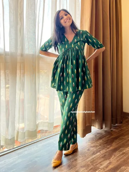 Our bestselling Ikat co-ords in stunning bottle green. The peplum top and pant set is a customer favorite for its flattering fit and vibrant, traditional pattern.
