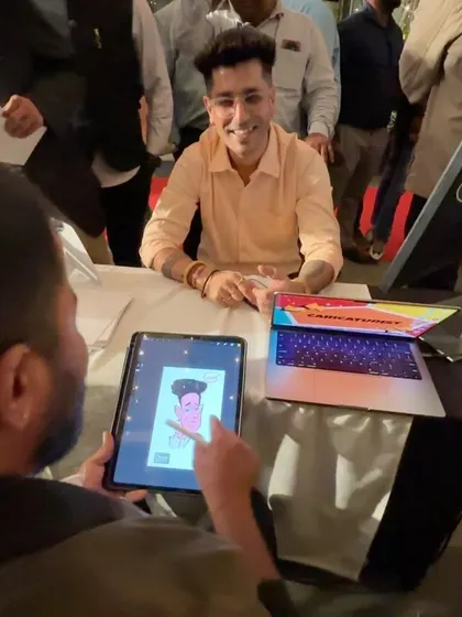 This photo shows my digital caricature setup with an iPad and laptop. It's a modern and efficient way to bring live art to any event.