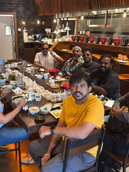 The team enjoying a meal together on our US tour. These are the moments that build the bond we share on and off stage.