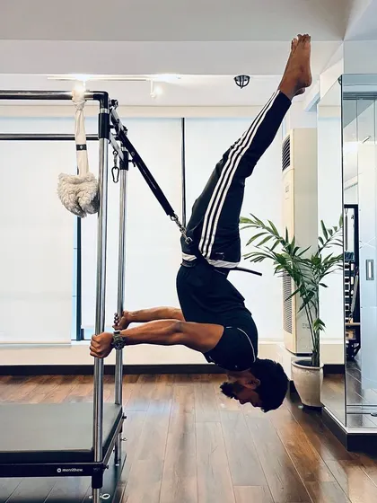Don't let fear limit your strength. This inverted pose is a testament to what you can achieve with consistent practice and belief in yourself.