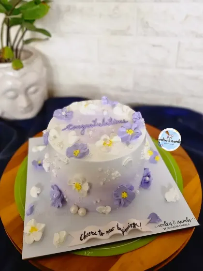 Feeling all Pinteresty with this one. A minimalist cake with delicate purple and white buttercream flowers, perfect for a simple and aesthetic celebration.