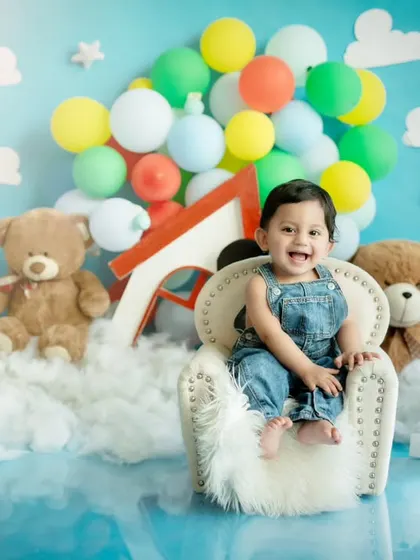 Sitting like a king in his little armchair, this one-year-old is ready for his next adventure. We have a variety of kid-sized furniture to make our sets more interactive.