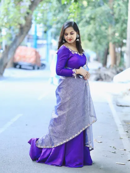 Another view of the purple Anarkali, showing its beautiful drape and flow.