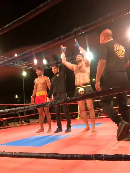 The referee raises our fighter's hand. A proud moment for him and for the entire Dynamic Kickboxing team.
