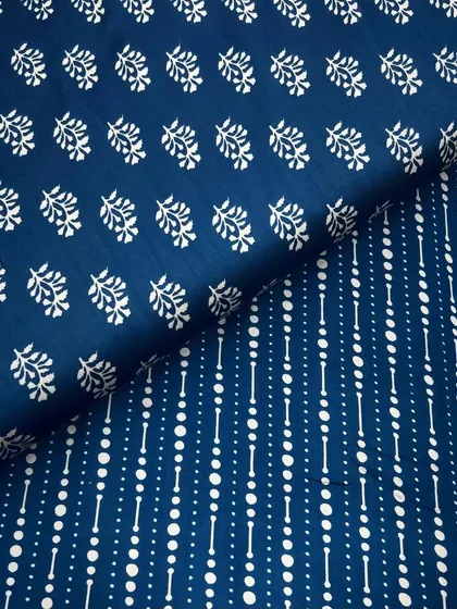 This printed modal satin combines two different prints in a classic blue and white palette, offering a versatile option for mix-and-match outfits.