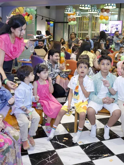 A candid shot of kids and parents enjoying the party atmosphere. Our open layout allows parents to relax while still keeping an eye on the fun.