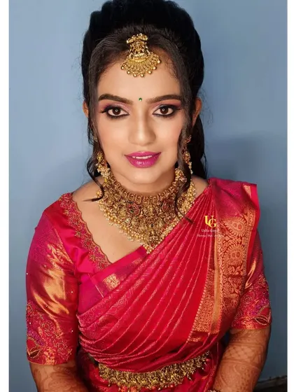 My gorgeous client Geetha, ready for her wedding reception. We opted for a glamorous look with shimmery pink eyeshadow, dramatic lashes, and a bright pink lip to match her beautiful red silk saree.