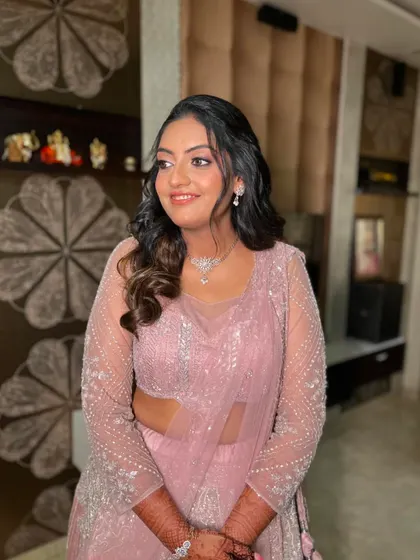 Another angle of the soft pink engagement look, showing how it enhances her natural features.