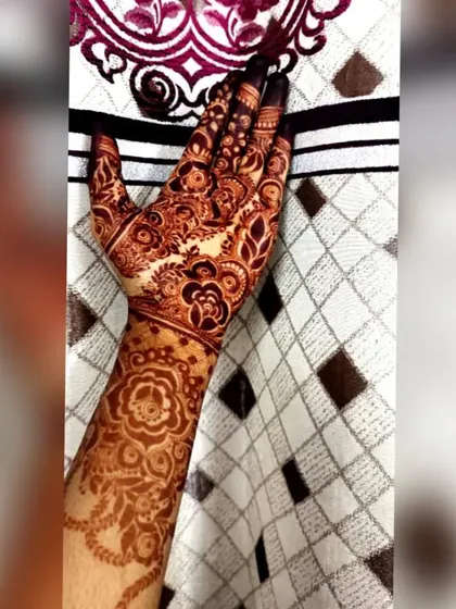 A close-up of a fully developed henna stain on the palm and wrist. The color is deep and even, which is what I always aim for with my natural paste.