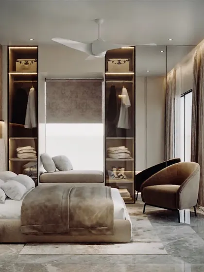 This design shows how to make a walk-in wardrobe feel integrated. I used open, backlit shelving as part of the bedroom itself, making it both a functional storage area and a beautiful display feature.