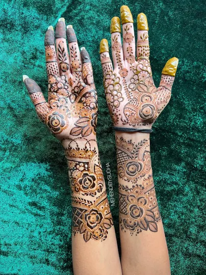 A close-up of the fusion floral design, showing the different techniques used on each hand.