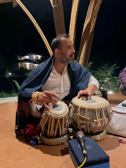 A friend playing the tabla during our kirtan night. Everyone brings their unique gifts to the community, co-creating a rich and diverse experience for all.