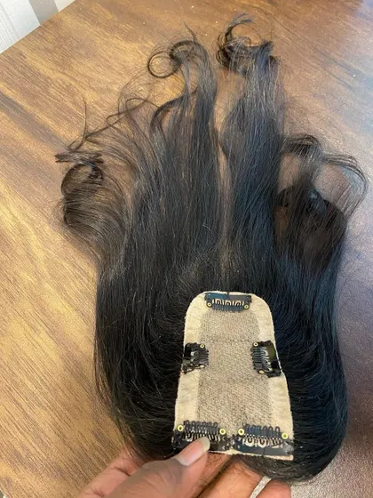 Here is the underside of a 2x5 silk base topper. You can see the secure clips that hold the piece gently but firmly in place without damaging your natural hair.
