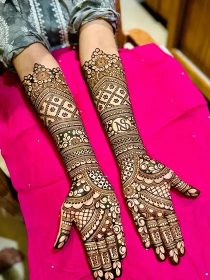 A personalized design with initials, combined with intricate traditional patterns.