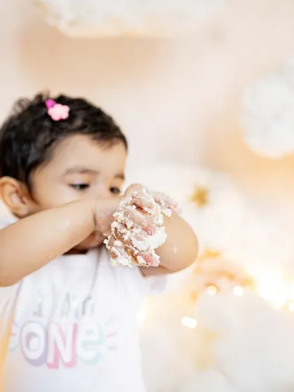 This little one is proud to be one and isn't afraid to get messy. The "I am ONE" shirt and a face full of frosting make for the perfect cake smash photo.