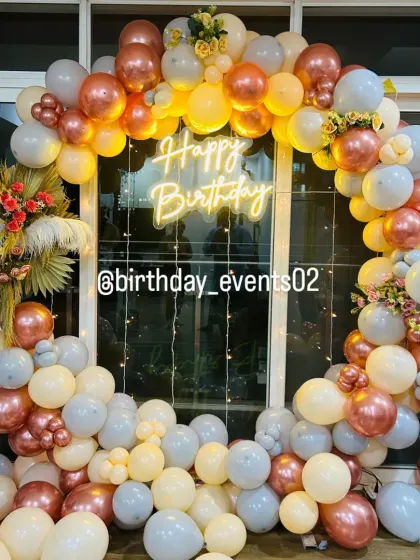 Another angle of our pastel and rose gold ring setup, showing how the balloons beautifully catch the light from the neon sign.