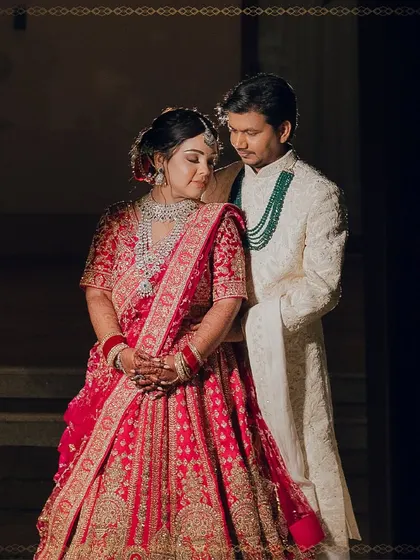 A fairytale moment for the bride and groom. Her traditional red lehenga and my soft glam makeup create a look that is both regal and romantic.