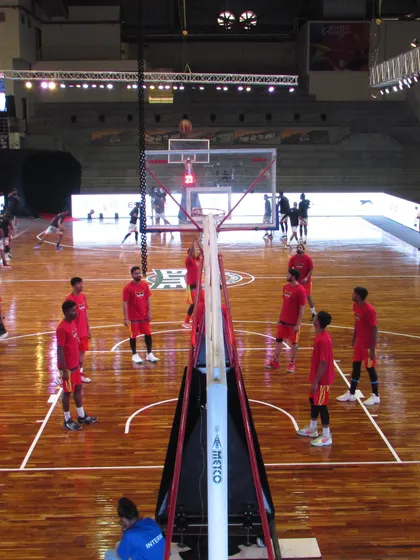 A team runs through shooting drills on our main court. The professional setup, including the polished wooden floor and clear court markings, provides an ideal environment for focused practice.