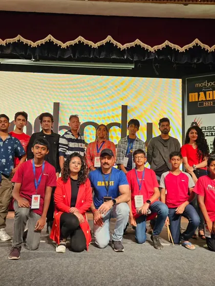 A group photo of the WMC team and performers with the event organizers at Madfit 2023.