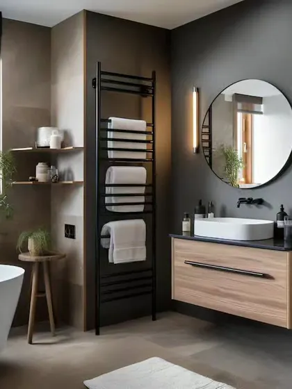 A contemporary bathroom featuring a sleek floating wood vanity and a round mirror. The heated towel rack adds a touch of luxury, while the neutral color palette creates a calm and relaxing environment.
