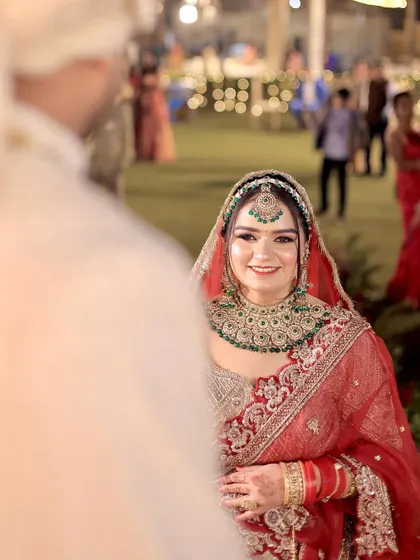 A classic shot of the bride looking towards the groom, capturing a moment of love and anticipation.