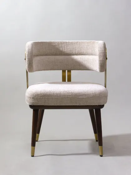 The front view of the armchair highlights its clean lines and comfortable, upholstered seat.