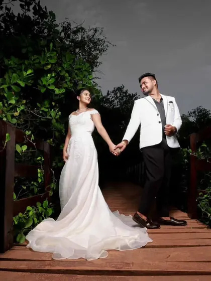 A romantic walk across a wooden bridge. I styled this couple in a simple yet elegant white mermaid gown and a contrasting white blazer for the groom for their pre-wedding shoot.