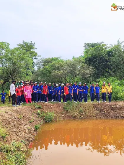 Students from Unique English School gather by a newly created pond at our Honeywell Pune site. Our nature walks educate children about the importance of water bodies in a forest ecosystem.