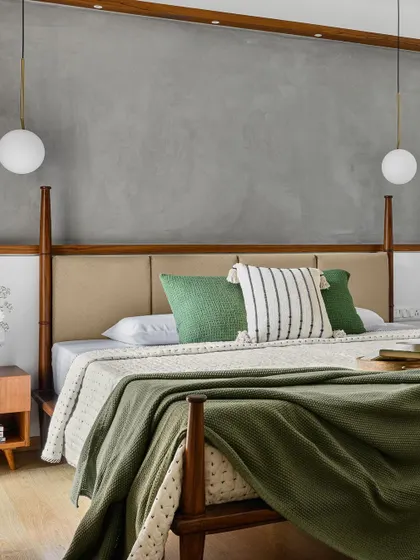 Another view of the 'Poorna' primary room's half-poster bed, showing how it creates a sense of grandeur without overwhelming the space.