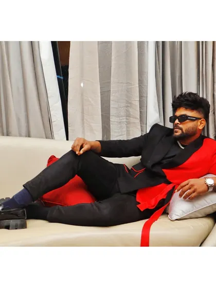 "Clothes mean nothing until someone lives in them." A red and black blazer that's all about drama and style.