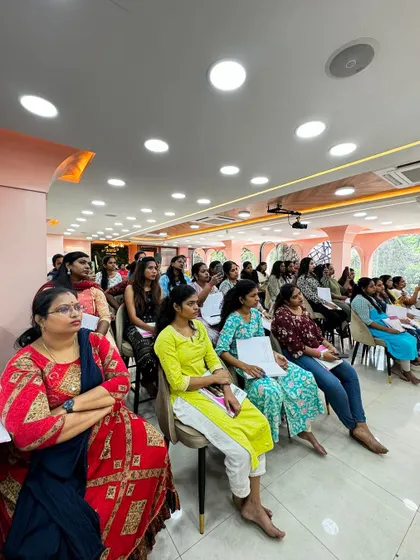 A wide shot of the classroom during a Muhurtham hairdo demonstration.