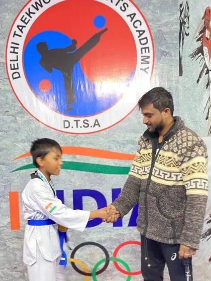 A handshake for a job well done. My junior champion Rohan after his victory at the 6th National Sikh Games.
