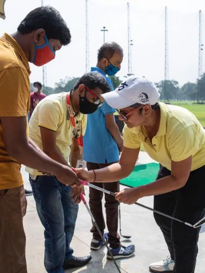 Coaching visually impaired golf enthusiasts with Enable India is a truly humbling experience. Here, I'm using touch to guide a student's grip, helping them feel the club and its position.