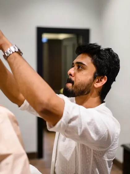 A friend making sure every hair is in place. It’s the little details and the help from loved ones that make the getting ready process special.