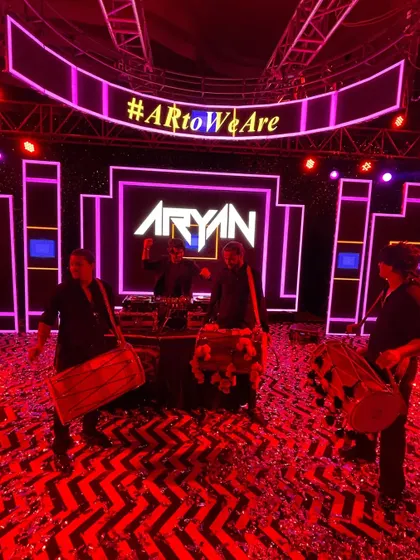 Fusing my beats with the power of live dhol players. This setup for a sangeet night in Jaipur created an electrifying atmosphere with my logo lighting up the stage.