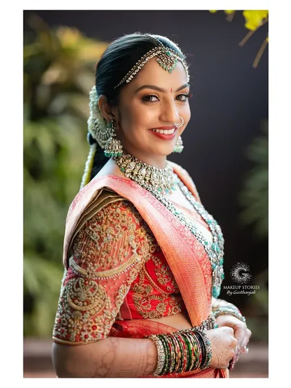 A full view of Likitha's stunning bridal attire. My services include professional saree draping to ensure the pleats are perfect and the silhouette is elegant, completing the head to toe bridal transformation.