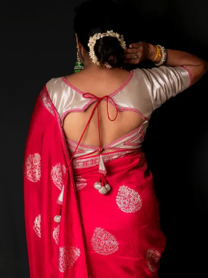 The full back view of the heart-cutout blouse, showcasing the craftsmanship and unique design.