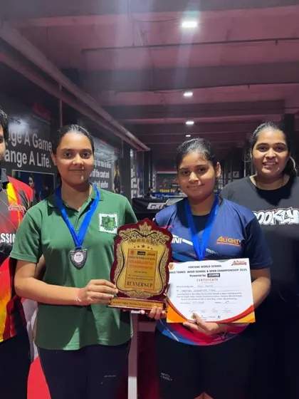 The runner-up girls team posing with their shield. Every match is a learning experience on the journey to becoming a champion.