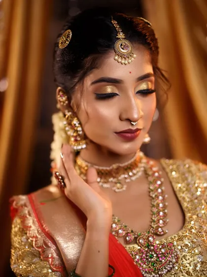 Another view of the golden eye makeup, showing how it catches the light. This look is ideal for evening events and flash photography.